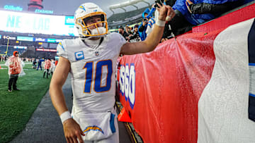 Dec 3, 2023; Foxborough, Massachusetts, USA; Los Angeles Chargers quarterback Justin Herbert (10) is congratulated by fans after defeating the New England Patriots at Gillette Stadium. Mandatory Credit: David Butler II-Imagn Images