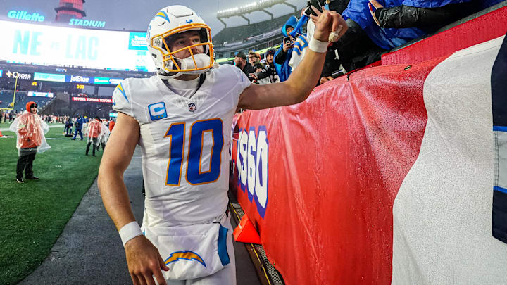 Dec 3, 2023; Foxborough, Massachusetts, USA; Los Angeles Chargers quarterback Justin Herbert (10) is congratulated by fans after defeating the New England Patriots at Gillette Stadium. Mandatory Credit: David Butler II-Imagn Images