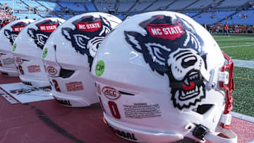 Sep 7, 2024; Charlotte, North Carolina, USA; North Carolina State Wolfpack helmets during pregame activity for the Dukes Mayo Classic against the Tennessee Volunteers at Bank of America Stadium. Mandatory Credit: Jim Dedmon-Imagn Images