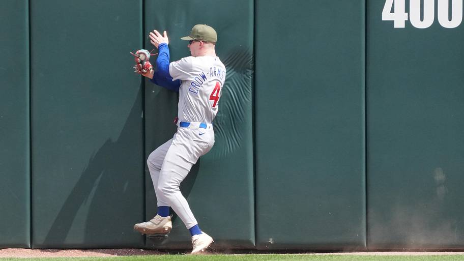 Pete Crow-Armstrong makes a catch at the wall