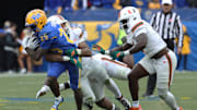 Nov 29, 2025; Pittsburgh, Pennsylvania, USA;  Pittsburgh Panthers running back Ja'Kyrian Turner (25) runs against the Miami Hurricanes during the third quarter at Acrisure Stadium. Mandatory Credit: Charles LeClaire-Imagn Images