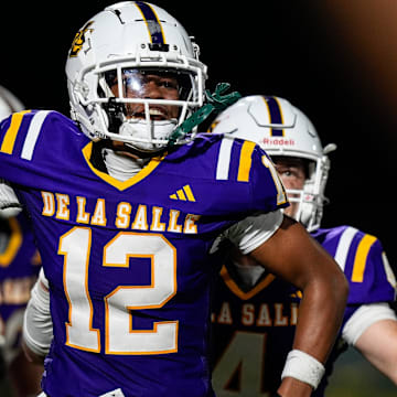 Warren De La Salle defensive back David Williams celebrates an interception against Davison during second half of Prep Kickoff Classic at Wayne State's Tom Adams Field in Detroit on Thursday, August 29, 2024.