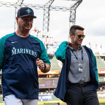 Seattle Mariners manager Scott Servais (9) and  president of baseball operations Jerry Dipoto walk off the field prior to the game against the Texas Rangers at T-Mobile Park in 2022.