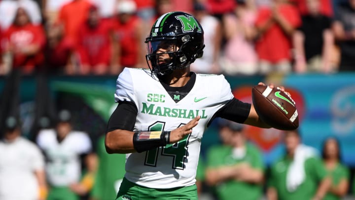 Oct 7, 2023; Raleigh, North Carolina, USA; Marshall Thundering Herd quarterback Cam Fancher (14) looks to throw during the first half against the North Carolina State Wolfpack at Carter-Finley Stadium. Mandatory Credit: Rob Kinnan-USA TODAY Sports