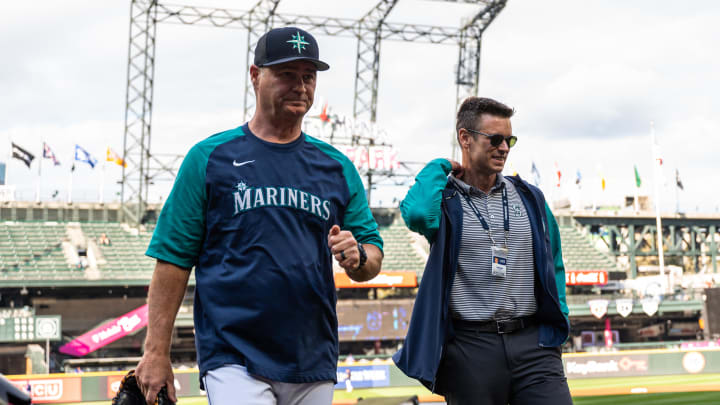 Seattle Mariners manager Scott Servais (9) and  president of baseball operations Jerry Dipoto walk off the field prior to the game against the Texas Rangers at T-Mobile Park in 2022.