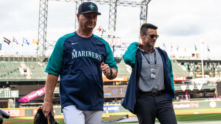 Seattle Mariners manager Scott Servais (left) and  President of Baseball Operations Jerry Dipoto walk off the field prior to a game against the Texas Rangers in 2022 at T-Mobile Park.