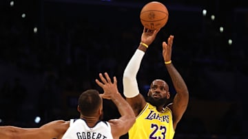 Oct 22, 2024; Los Angeles, California, USA; Los Angeles Lakers forward LeBron James (23) shoots against Minnesota Timberwolves center Rudy Gobert (27) during the first quarter at Crypto.com Arena. Mandatory Credit: Jason Parkhurst-Imagn Images