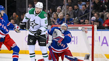 Jan 7, 2025; New York, New York, USA;  Dallas Stars left wing Jason Robertson (21) screens a shot in front of New York Rangers goaltender Jonathan Quick (32) during the second period at Madison Square Garden. Mandatory Credit: Dennis Schneidler-Imagn Images