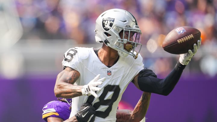 Aug 10, 2024; Minneapolis, Minnesota, USA; Las Vegas Raiders cornerback Jack Jones (18) interecpts a pass from Minnesota Vikings quarterback J.J. McCarthy (9) in the second quarter at U.S. Bank Stadium. Mandatory Credit: Brad Rempel-USA TODAY Sports