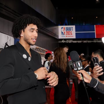 Jun 26, 2024; Brooklyn, NY, USA; Jared McCain is interviewed on the red carpet after arriving for the first round of the 2024 NBA Draft at Barclays Center. Mandatory Credit: Brad Penner-USA TODAY Sports