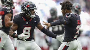 Houston Texans wide receiver John Metchie III (8) and wide receiver Tank Dell (3)
