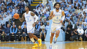 Jan 7, 2023; Chapel Hill, North Carolina, USA;  North Carolina Tar Heels guard Caleb Love (2) comes up the court with North Carolina Tar Heels guard R.J. Davis (4) against the Notre Dame Fighting Irish during the second half at Dean E. Smith Center. Mandatory Credit: James Guillory-Imagn Images