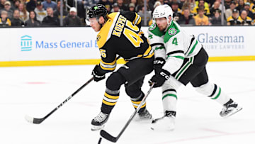 Oct 24, 2024; Boston, Massachusetts, USA;  Dallas Stars defenseman Miro Heiskanen (4) deflects the puck away from Boston Bruins left wing Cole Koepke (45) during the first period at TD Garden. Mandatory Credit: Bob DeChiara-Imagn Images