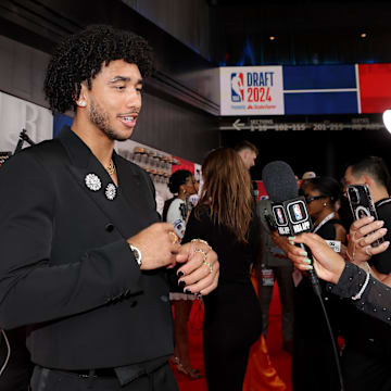 Jun 26, 2024; Brooklyn, NY, USA; Jared McCain is interviewed on the red carpet after arriving for the first round of the 2024 NBA Draft at Barclays Center. Mandatory Credit: Brad Penner-Imagn Images