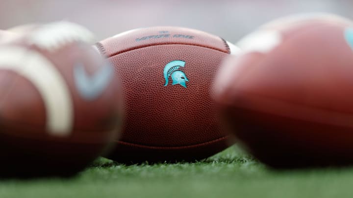 Oct 12, 2019; Madison, WI, USA; Michigan State Spartans logo on footballs during warmups prior to the game against the Wisconsin Badgers at Camp Randall Stadium. Mandatory Credit: Jeff Hanisch-USA TODAY Sports