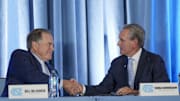 Dec 12, 2024; Chapel Hill, NC, USA;  North Carolina Tar Heels new head coach Bill Belichick shakes hands with athletic director Bubba Cunningham at Loudermilk Center for Excellence. 