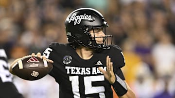Oct 26, 2024; College Station, Texas, USA; Texas A&M Aggies quarterback Conner Weigman (15) looks to throw the ball during the third quarter against the LSU Tigers. The Aggies defeated the Tigers 38-23; at Kyle Field. Mandatory Credit: Maria Lysaker-Imagn Images. 
