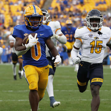 Aug 31, 2024; Pittsburgh, Pennsylvania, USA;  Pittsburgh Panthers running back Desmond Reid (0) runs on his way to scoring a touchdown against the Kent State Golden Flashes during the third quarter at Acrisure Stadium. Pittsburgh won 55-24. Mandatory Credit: Charles LeClaire-Imagn Images