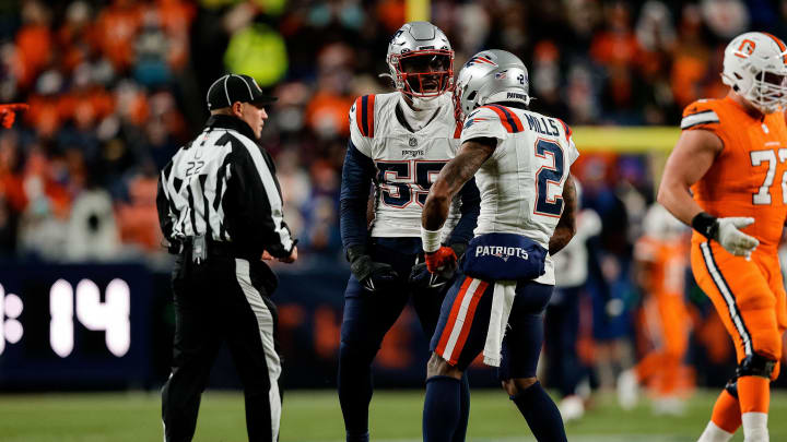 Dec 24, 2023; Denver, Colorado, USA; New England Patriots linebacker Josh Uche (55) reacts with cornerback Jalen Mills (2) after a play in the third quarter against the Denver Broncos at Empower Field at Mile High. Mandatory Credit: Isaiah J. Downing-USA TODAY Sports