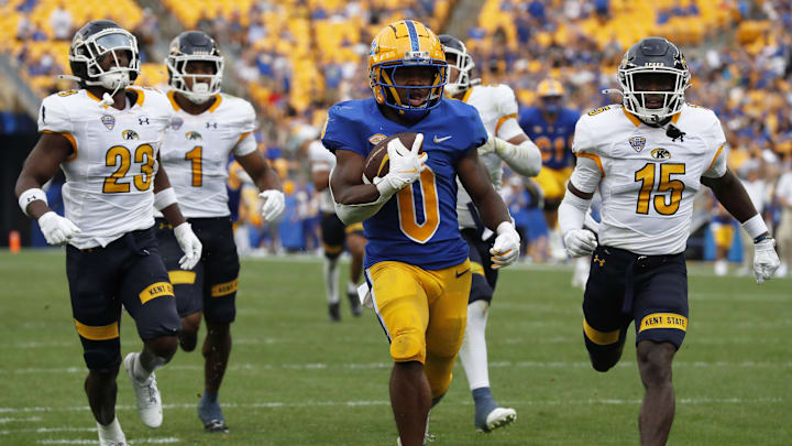 Aug 31, 2024; Pittsburgh, Pennsylvania, USA;  Pittsburgh Panthers running back Desmond Reid (0) runs on his way to scoring a touchdown against the Kent State Golden Flashes during the third quarter at Acrisure Stadium. Pittsburgh won 55-24. Mandatory Credit: Charles LeClaire-Imagn Images