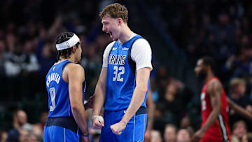Dec 3, 2025; Dallas, Texas, USA;  Dallas Mavericks forward Cooper Flagg (32) celebrates with Dallas Mavericks guard Ryan Nembhard (9) 