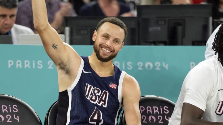 Aug 6, 2024; Paris, France; United States shooting guard Stephen Curry (4) reacts on the bench in the second half against Brazil in a men’s basketball quarterfinal game during the Paris 2024 Olympic Summer Games at Accor Arena. Mandatory Credit: Kyle Terada-USA TODAY Sports