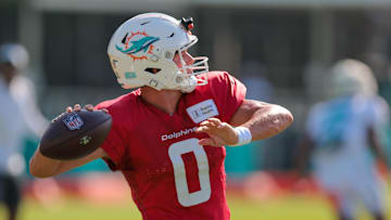 Jul 29, 2025; Miami Gardens, FL, USA; Miami Dolphins quarterback Zach Wilson (0) throws the football during training camp at Baptist Health Training Complex. Mandatory Credit: Sam Navarro-Imagn Images