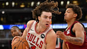 Oct 9, 2025; Chicago, Illinois, USA; Chicago Bulls guard Josh Giddey (3) controls the ball against Cleveland Cavaliers guard Craig Porter Jr. (9) during the second half at United Center. Mandatory Credit: Patrick Gorski-Imagn Images