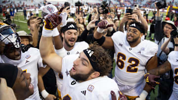 Nov 30, 2024; Tucson, Arizona, USA; Arizona State Sun Devils running back Cam Skattebo (4) celebrates after defeating the Arizona Wildcats during the Territorial Cup at Arizona Stadium. Mandatory Credit: Mark J. Rebilas-Imagn Images

