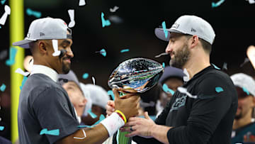 Feb 9, 2025; New Orleans, LA, USA; Philadelphia Eagles quarterback Jalen Hurts (1) passes the Vince Lombardi Trophy to Philadelphia Eagles head coach Nick Sirianni after defeating the Kansas City Chiefs in Super Bowl LIX at Ceasars Superdome. Mandatory Credit: Mark J. Rebilas-Imagn Images