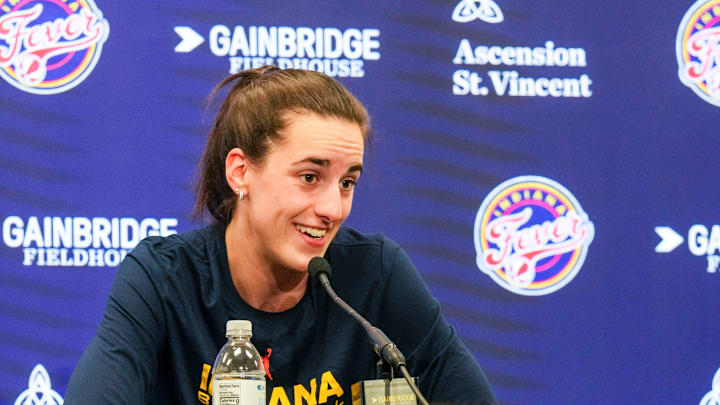 IndyStar sports reporter Chloe Peterson listens to Indiana Fever guard Caitlin Clark (22) answer a question on Friday, Sept. 13, 2024, during a game between the Indiana Fever and the Las Vegas Aces in Indianapolis. The Aces defeated the Fever, 78-74.