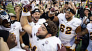 Arizona State Sun Devils running back Cam Skattebo (4) celebrates after defeating the Arizona Wildcats during the Territorial Cup at Arizona Stadium. 