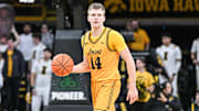 Nov 18, 2025; Iowa City, Iowa, USA; Iowa Hawkeyes guard Bennett Stirtz (14) controls the ball during the second half against the Southeast Missouri State Redhawks at Carver-Hawkeye Arena. Mandatory Credit: Jeffrey Becker-Imagn Images