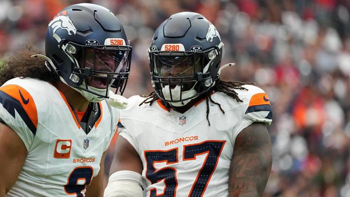 Denver Broncos safety Talanoa Hufanga (9) and linebacker Dre Greenlaw (57)
