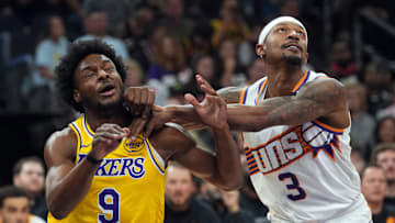 Oct 17, 2024; Phoenix, Arizona, USA; Los Angeles Lakers guard Bronny James (9) and Phoenix Suns guard Bradley Beal (3) battle for position during the second half at Footprint Center. Mandatory Credit: Joe Camporeale-Imagn Images