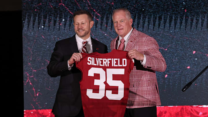 Dec 1, 2025; Fayetteville, AR, USA; Arkansas Razorbacks head football coach Ryan Silverfield is introduced by vice chancellor and director of athletics Hunter Yurachek during a public held at the Walker Indoor Pavilion. Mandatory Credit: Nelson Chenault-Imagn Images
