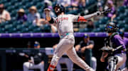 Jun 22, 2025; Denver, Colorado, USA; Arizona Diamondbacks third baseman Eugenio Suarez (28) watches his ball on a double in the second inning against the Colorado Rockies at Coors Field. Mandatory Credit: Isaiah J. Downing-Imagn Images