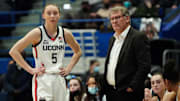 Feb 25, 2022; Hartford, Connecticut, USA; UConn Huskies head coach Geno Auriemma talks with guard Paige Bueckers (5) from the sideline as they take on the St. John's Red Storm in the second half at XL Center. Mandatory Credit: David Butler II-Imagn Images
