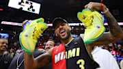 Mar 29, 2024; Miami, Florida, USA;  Brazilian professional soccer player Neymar Jr. reacts after receiving a pair of shoes from Miami Heat forward Jimmy Butler (not pictured) after the game against the Portland Trail Blazers at Kaseya Center. Mandatory Credit: Sam Navarro-Imagn Images
