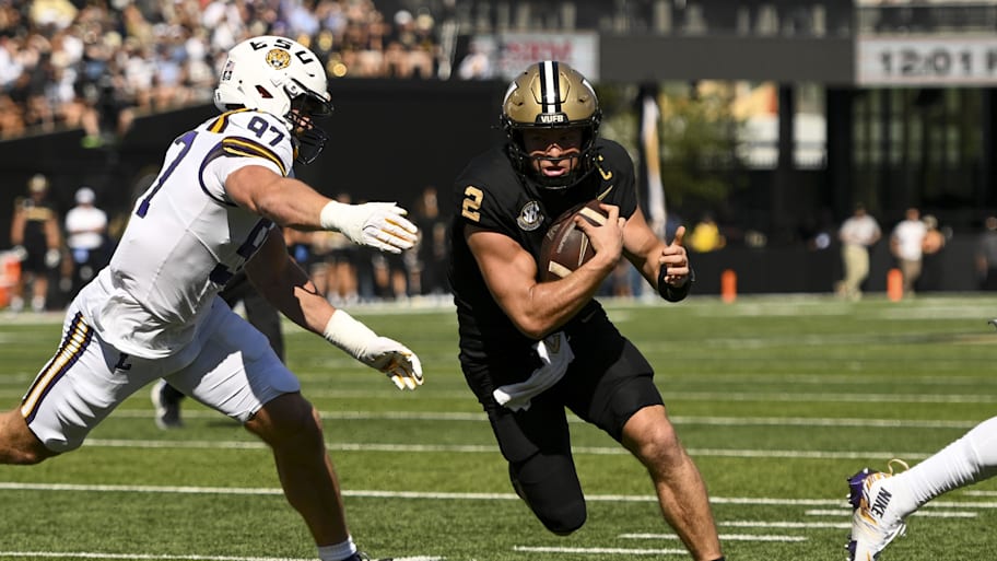 Vanderbilt Commodores quarterback Diego Pavia runs with the bal;