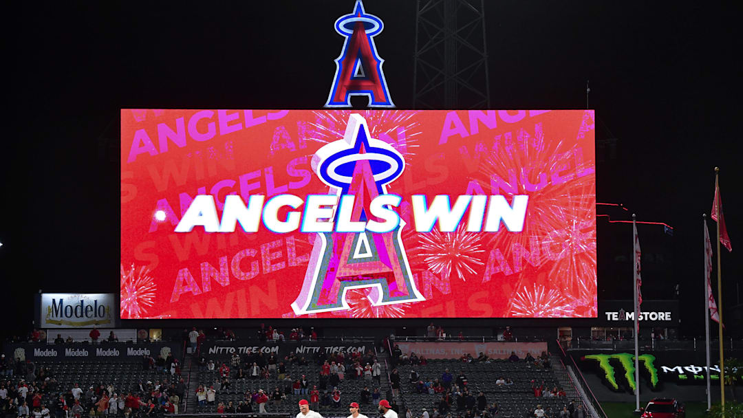 May 5, 2026; Anaheim, California, USA; Los Angeles Angels center fielder Mike Trout (27) left fielder Bryce Teodosio (22) and right fielder Jo Adell (7) celebrate the victory against the Chicago White Sox at Angel Stadium. Mandatory Credit: Gary A. Vasquez-Imagn Images