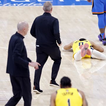 Jun 22, 2025; Oklahoma City, Oklahoma, USA; Indiana Pacers guard Tyrese Haliburton (0) reacts after an apparent injury following a play against the Oklahoma City Thunder during the first half of game seven of the 2025 NBA Finals at Paycom Center. Mandatory Credit: Alonzo Adams-Imagn Images