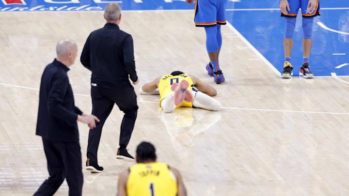 Jun 22, 2025; Oklahoma City, Oklahoma, USA; Indiana Pacers guard Tyrese Haliburton (0) reacts after an apparent injury following a play against the Oklahoma City Thunder during the first half of game seven of the 2025 NBA Finals at Paycom Center. Mandatory Credit: Alonzo Adams-Imagn Images