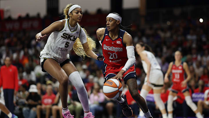 Jul 29, 2025; Washington, District of Columbia, USA; Washington Mystics guard Brittney Sykes (20) drives to the basket as Chicago Sky forward Angel Reese (5) defends in the second half at CareFirst Arena. Mandatory Credit: Geoff Burke-Imagn Images