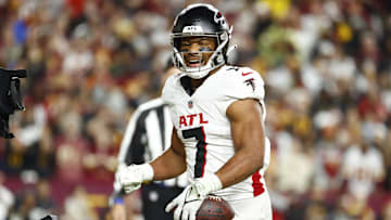 Dec 29, 2024; Landover, Maryland, USA; Atlanta Falcons running back Bijan Robinson (7) celebrates after scoring a touchdown against the Washington Commanders during the first half at Northwest Stadium.