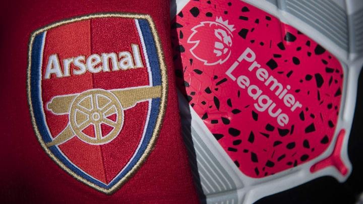 The Arsenal Club Crest with a Premier League Match Ball