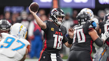 Dec 1, 2024; Atlanta, Georgia, USA; Atlanta Falcons quarterback Kirk Cousins (18) passes against the Los Angeles Chargers during the first half at Mercedes-Benz Stadium. Mandatory Credit: Dale Zanine-Imagn Images