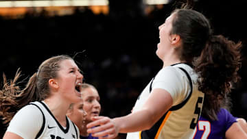 Iowa guard Taylor Stremlow (1) and Iowa center Ava Heiden (5) react Nov. 9, 2025 during a women’s basketball game against the Evansville Purple Aces at Carver-Hawkeye Arena in Iowa City, Iowa.