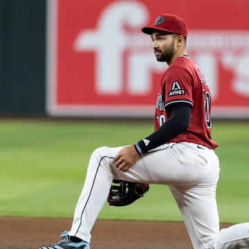 May 28, 2025; Phoenix, Arizona, USA; Arizona Diamondbacks second baseman Jordan Lawlar reacts after make a throwing error in the sixth inning against the Pittsburgh Pirates at Chase Field. Mandatory Credit: Mark J. Rebilas-Imagn Images