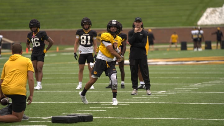 Missouri Tigers quarterback Drew Pyne follows through on a pass during practice at Faurot Field In Columbia, Mo. on Tuesday, August 13, 2024.